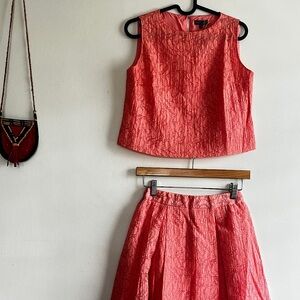 Two-piece Vince Camuto set in a vibrant coral color
